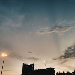 Low angle view of silhouette building against sky during sunset