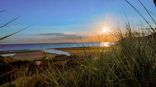 Scenic view of sunset over sea