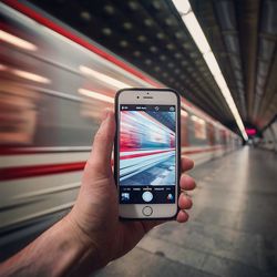 Cropped image of woman holding smart phone
