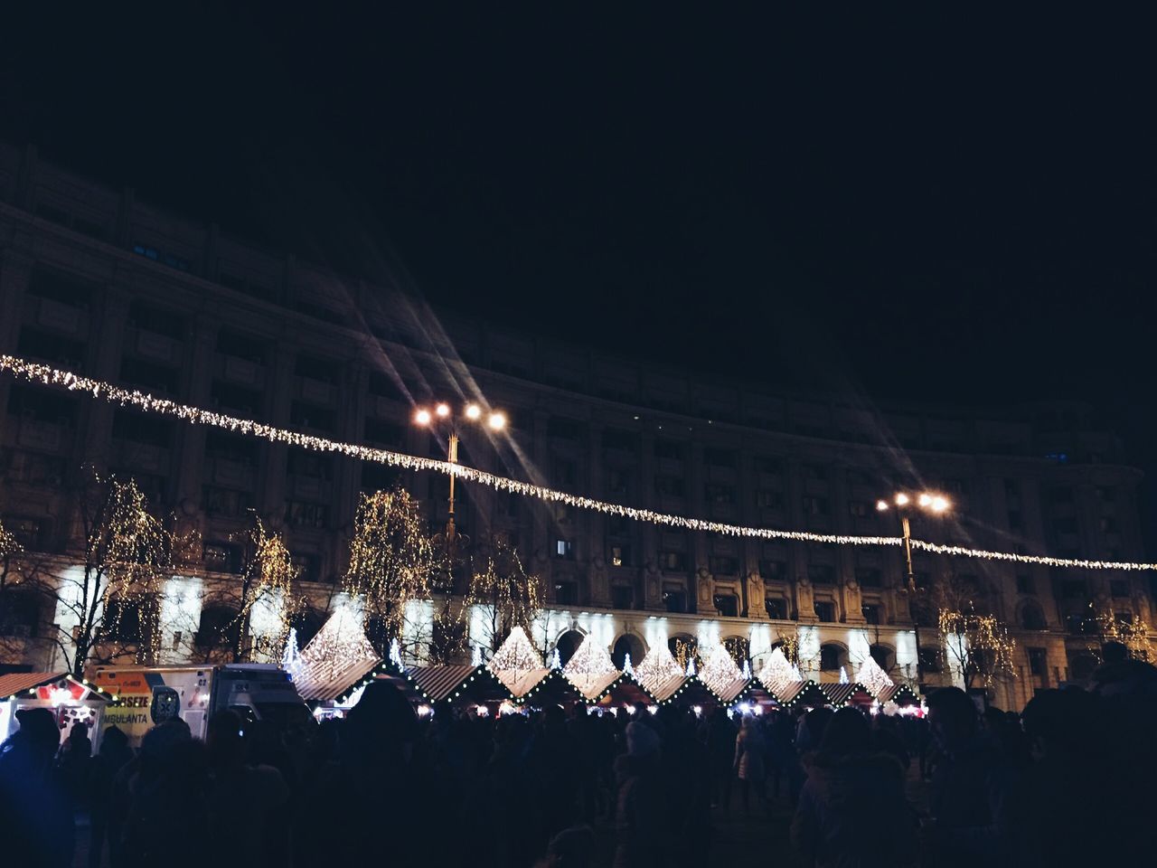 CROWD AT CONCERT AGAINST SKY