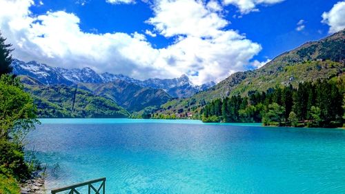 Scenic view of lake against cloudy sky