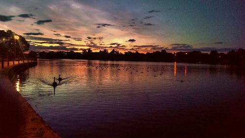 Scenic view of lake at sunset