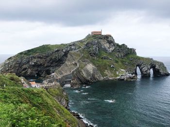 Scenic view of sea and rocks against sky