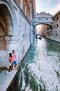 People on bridge over canal