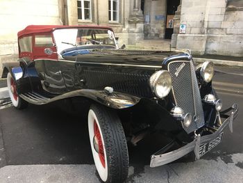 Vintage car parked on street in city