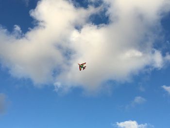 Low angle view of colorful kite against sky
