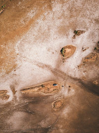 Full frame shot of a desert with a car parked