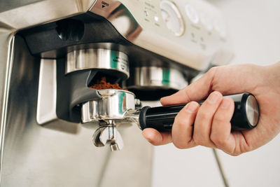 Close-up of hand holding coffee