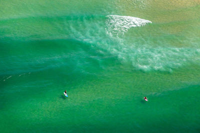 High angle view of people in sea