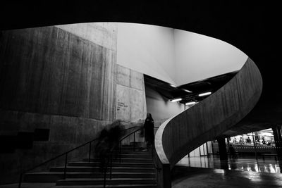 Low angle view of woman walking on staircase