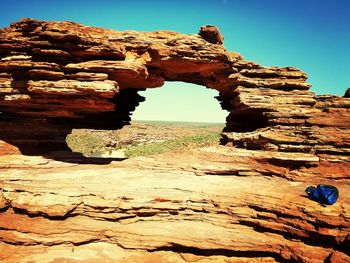 Scenic view of desert against clear blue sky