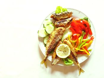 High angle view of fruits in plate on table