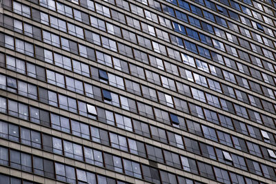 Full frame shot of building with glass windows