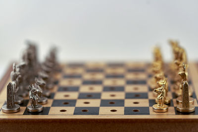 Close-up of chess pieces on table