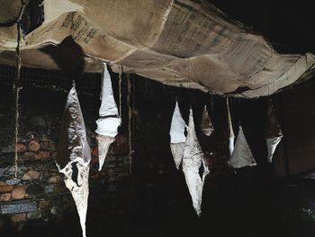 Close-up of clothes drying on wood against the sky