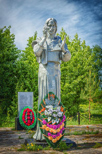 Statue against stone wall