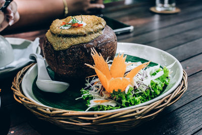 High angle view of food in wicker basket on table