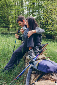 Full length of couple on field