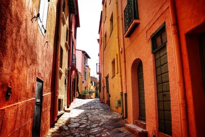 Narrow alley amidst buildings in town