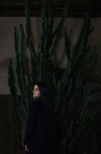 Portrait of woman on plant