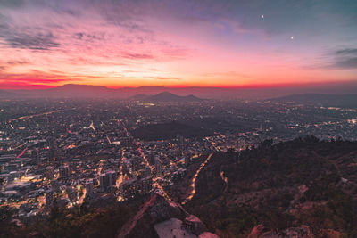 Aerial view of townscape against sky during sunset