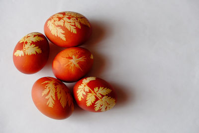 Close-up of oranges over white background