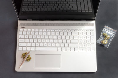 High angle view of laptop and book on table
