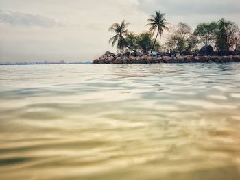 Scenic view of sea against sky at sunset