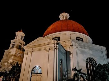 Low angle view of cathedral against sky at night