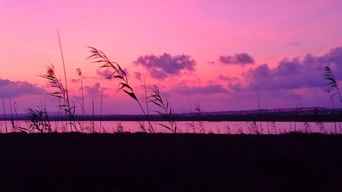 Silhouette landscape against sky during sunset