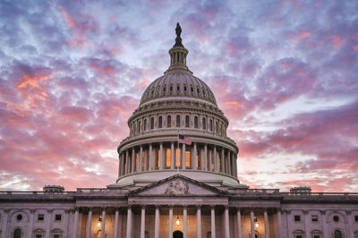 Low angle view of building against sky during sunset