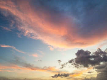 Low angle view of dramatic sky during sunset