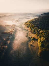 Aerial view of landscape against sky during sunset