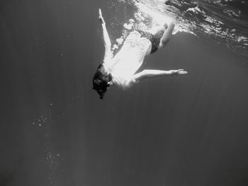 Low angle view of person swimming in sea