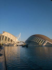 Low angle view of bridge against clear blue sky