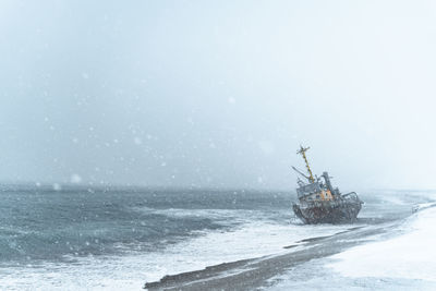 Scenic view of sea against sky during winter