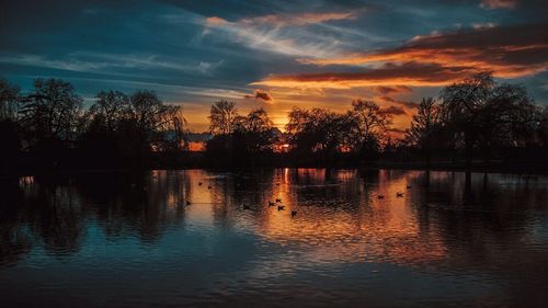 Scenic view of lake at sunset