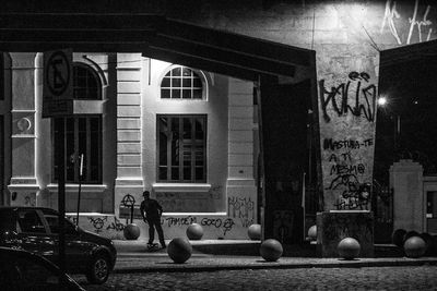 Woman standing against wall