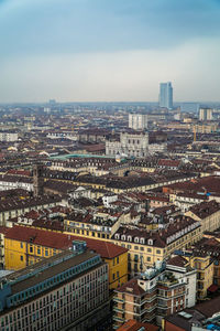 High angle view of buildings in city against sky