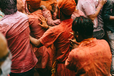 Men playing holi in city