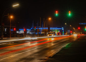 Illuminated city street at night