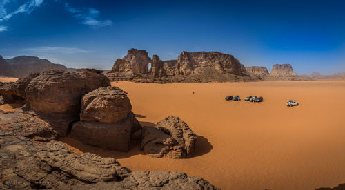 Rock formations on landscape against sky