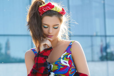 Portrait of young woman looking away