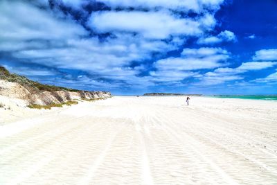 Scenic view of sea against cloudy sky