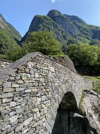 View of stone wall with mountain in background