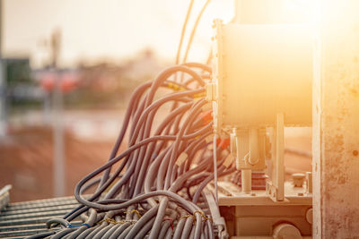 Close-up of machine part during sunny day