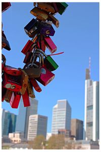 Low angle view of tall building against clear blue sky