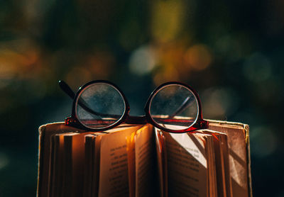 Close-up of eyeglasses on book