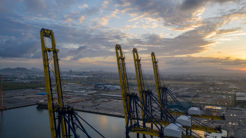 Aerial view commercial sea port warehouse and crane ship, container ship at industrial port