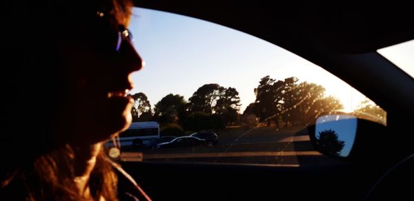 Portrait of man seen through car windshield